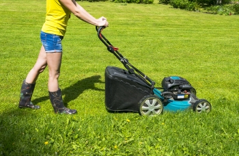 girl mowing lawn 